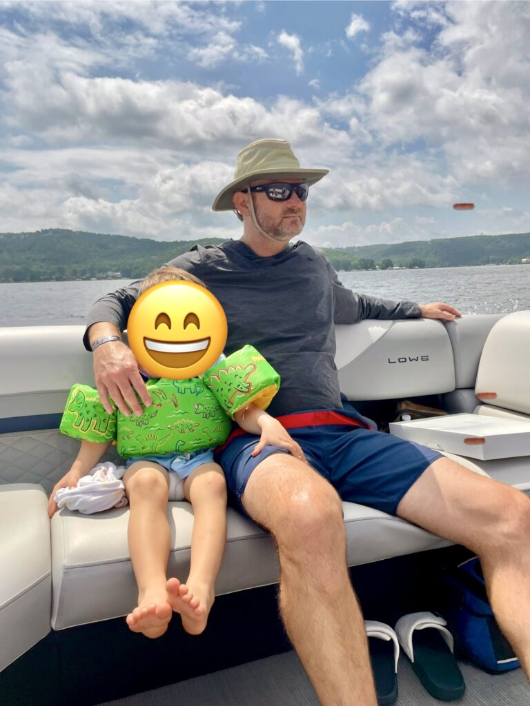 man wearing goruck sun hoodie on boat