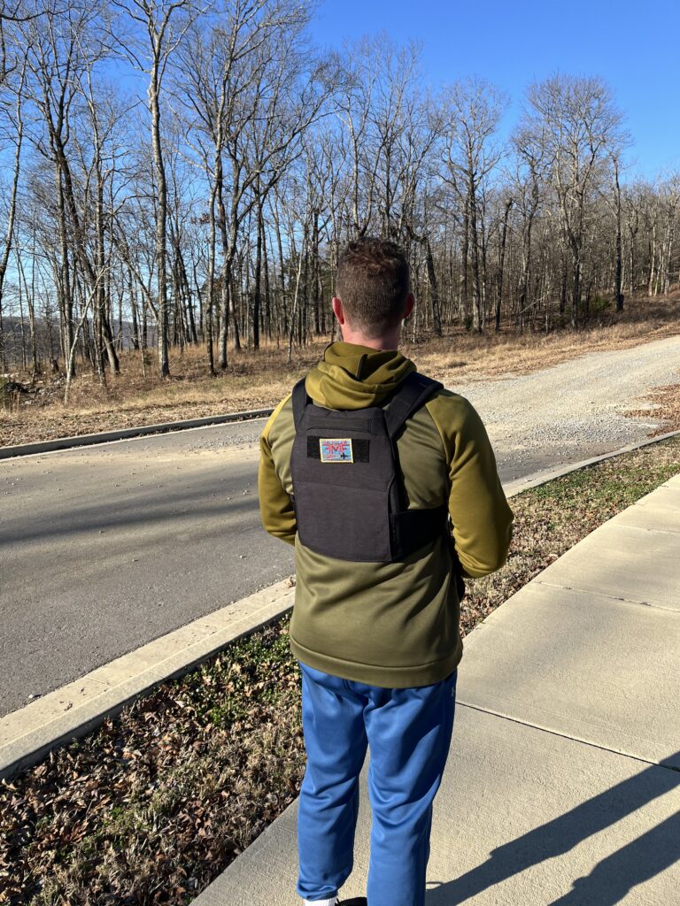 male with goruck rucking weight vest on cold day