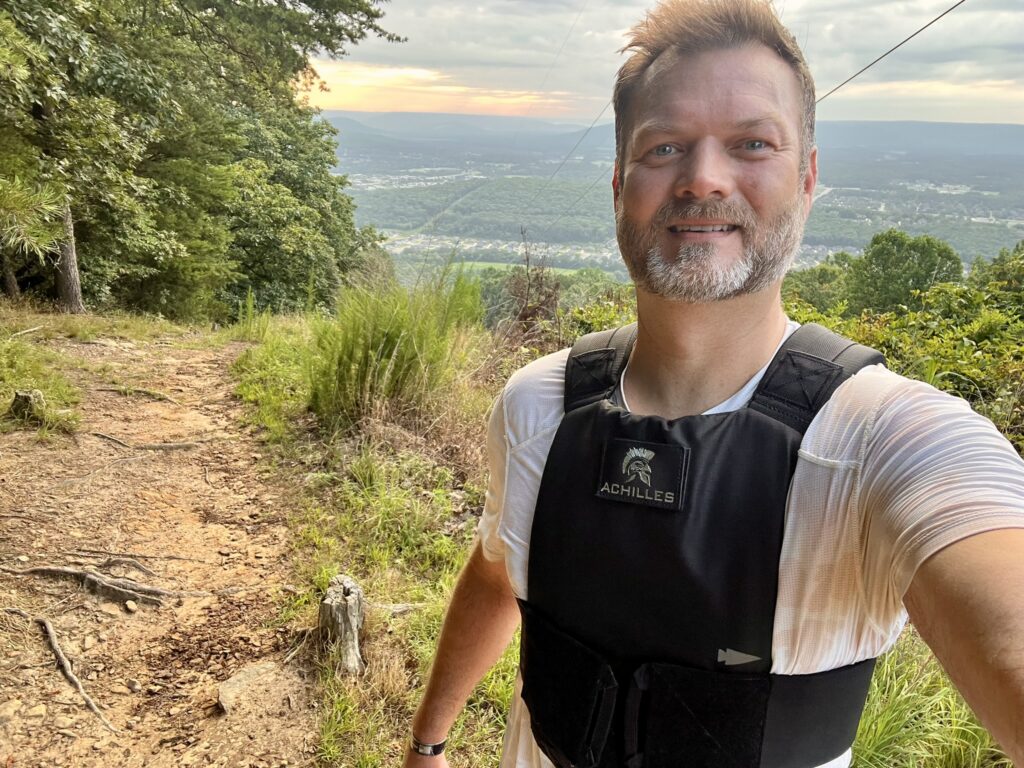 man with goruck achilles vest on mountain